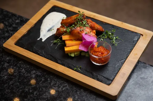 Chicken wings in hot sauce