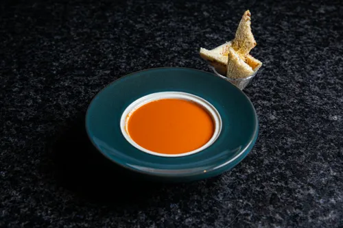Tomato soup with croutons and cheese