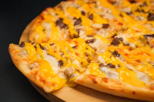 Pizza with cheese sauce