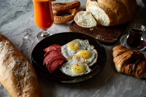 Fried eggs with sausage