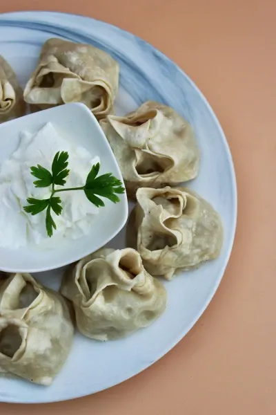 Manti with minced meat and pumpkin